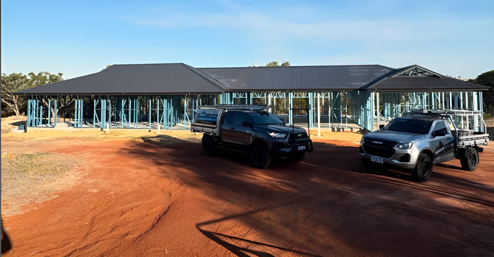 Above All Metal Roofing crew and service vehicles on site at a Perth roofing project